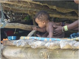 baby playing with the cat